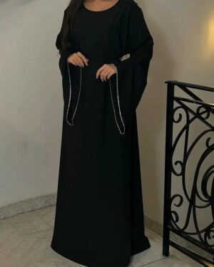 Black dress with an abaya touch and dangling silver sleeves